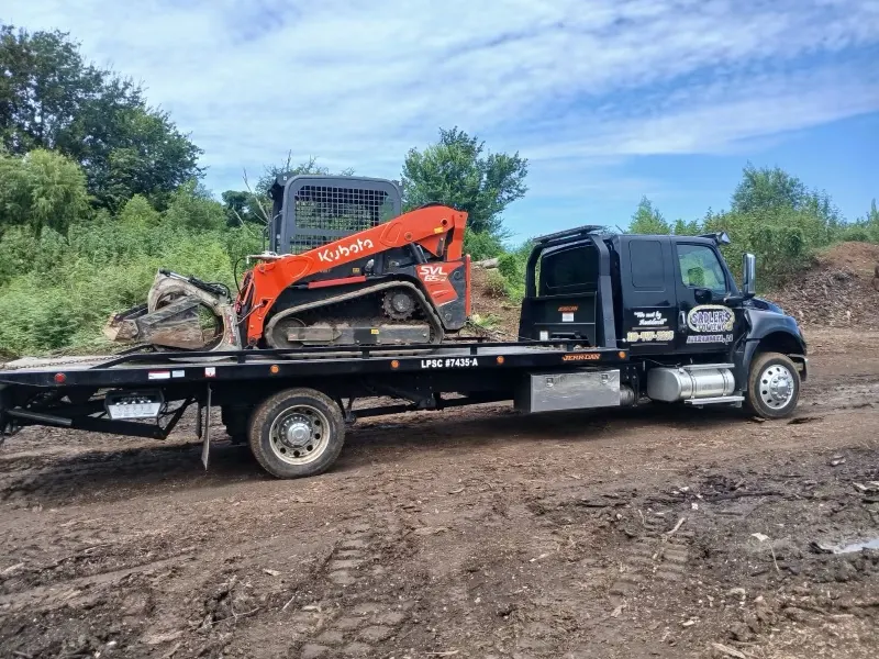 Kubota track loader on a Sadler's Towing rollback